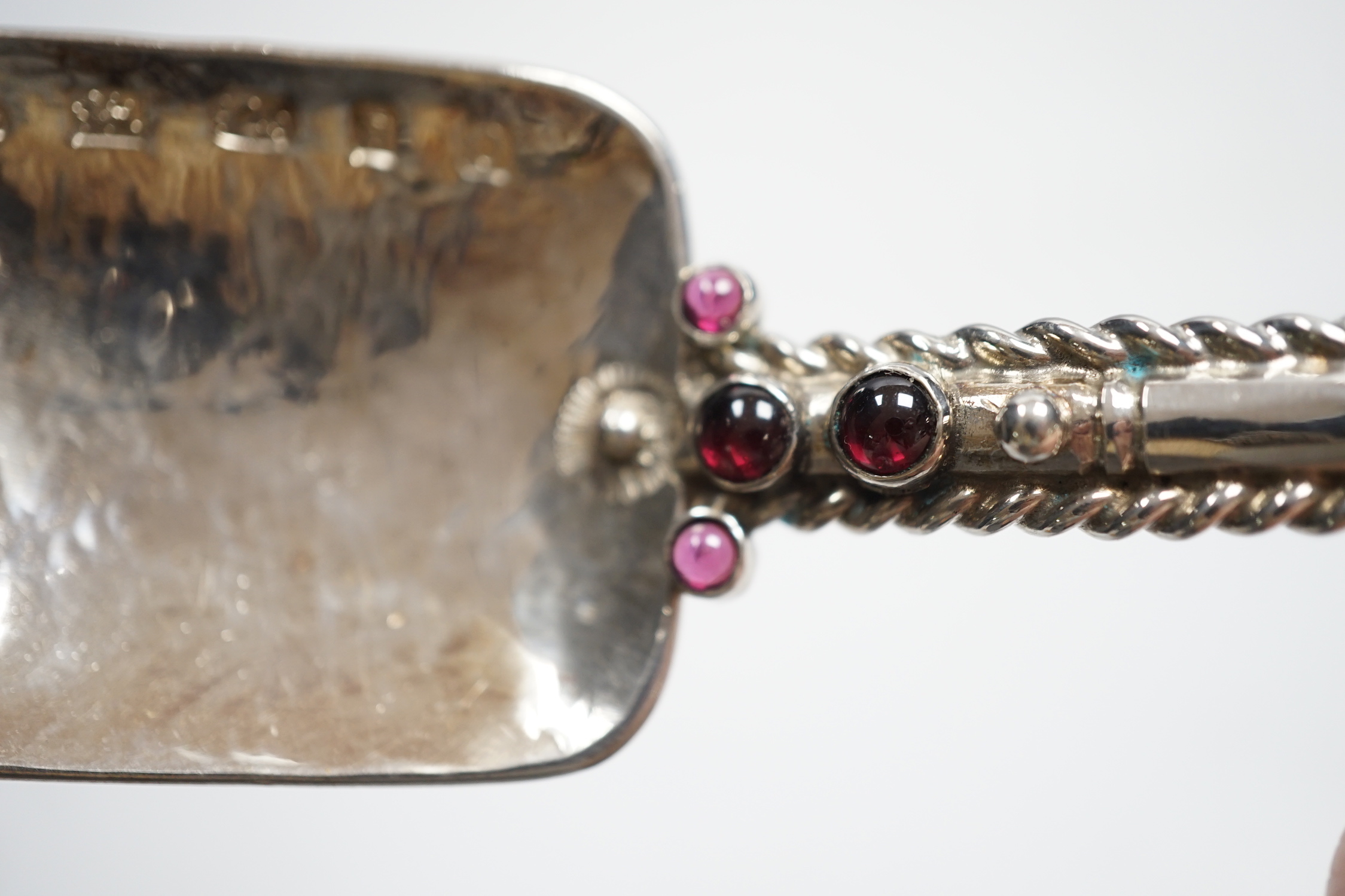 A modern Arts & Crafts silver and four stone cabochon garnet set spoon, maker HNG, London, 2013, 23cm, gross weight 115 grams.